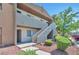 Two story condo with stucco exterior, stairway to upper units and desert landscaping at 3151 Soaring Gulls Dr # 2050, Las Vegas, NV 89128
