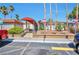 Community clubhouse exterior featuring accessible ramps, mature trees, and reserved parking at 3151 Soaring Gulls Dr # 2050, Las Vegas, NV 89128
