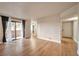 Open living room with wood floors, access to the balcony, and natural light at 3151 Soaring Gulls Dr # 2050, Las Vegas, NV 89128