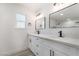 Modern bathroom features double sinks, white cabinets, and black fixtures at 3463 Haverford Ave, Las Vegas, NV 89121
