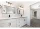 Bathroom vanity with double sinks, white cabinets, and modern fixtures at 3463 Haverford Ave, Las Vegas, NV 89121