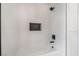 Modern bath/shower combo with white subway tile, black fixtures, and a built-in niche for toiletries at 3463 Haverford Ave, Las Vegas, NV 89121