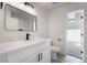 Stylish bathroom with a modern vanity, sleek fixtures, and a toilet, complemented by contemporary design elements at 3463 Haverford Ave, Las Vegas, NV 89121