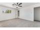 Neutral bedroom with a ceiling fan, closet, and bright window providing natural light at 3463 Haverford Ave, Las Vegas, NV 89121
