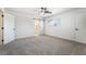 Neutral bedroom with a ceiling fan and en suite bathroom with a sliding barn door at 3463 Haverford Ave, Las Vegas, NV 89121