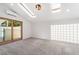 Bright bedroom with a sliding glass door to a patio, skylights and unique glass block window at 3463 Haverford Ave, Las Vegas, NV 89121