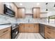 Modern kitchen with stainless steel appliances, stylish countertops, and bright, neutral-toned cabinetry at 3463 Haverford Ave, Las Vegas, NV 89121