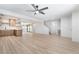 Stylish living space showcasing an open layout with a kitchen, staircase, and access to the backyard pool at 3463 Haverford Ave, Las Vegas, NV 89121