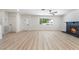 Spacious living area features a fireplace, white walls, and ample natural light from a large window at 3463 Haverford Ave, Las Vegas, NV 89121