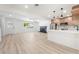 Spacious living room with a fireplace, modern kitchen, and plenty of natural light at 3463 Haverford Ave, Las Vegas, NV 89121