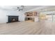 Open-concept living area features a fireplace, modern kitchen, and seamless access to an outdoor pool area at 3463 Haverford Ave, Las Vegas, NV 89121