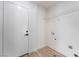 Mud room with plank floors, a white door to the exterior and wire rack shelving at 3463 Haverford Ave, Las Vegas, NV 89121