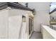 Patio area leading to the pool with outdoor lighting and a white stucco wall at 3463 Haverford Ave, Las Vegas, NV 89121