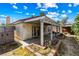 View of the backyard, with a covered patio, gazebo, and basic landscaping at 371 Cambray St, Henderson, NV 89074