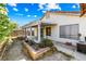 Backyard view featuring a covered patio, sparse landscaping and block wall fence at 371 Cambray St, Henderson, NV 89074