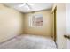 Bedroom featuring a ceiling fan, window and mirrored closet doors at 371 Cambray St, Henderson, NV 89074