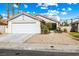 Charming single-story home featuring a two-car garage and low maintenance desert landscaping at 371 Cambray St, Henderson, NV 89074