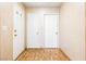 Foyer with decorative wall paper, hardwood floors, and white doors at 371 Cambray St, Henderson, NV 89074