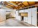 Unfinished garage features cabinets, a work bench, and unfinished walls at 371 Cambray St, Henderson, NV 89074