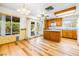 Sunlit eat-in kitchen area with wood cabinets, tile floors, and natural light at 371 Cambray St, Henderson, NV 89074