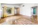 Spacious living room with bright windows, hardwood floors, and white walls at 371 Cambray St, Henderson, NV 89074