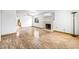 Spacious living room with a cozy fireplace, natural light, and hardwood floors at 371 Cambray St, Henderson, NV 89074