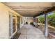 Covered patio with access to house, with outdoor lighting and basic landscaping at 371 Cambray St, Henderson, NV 89074