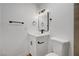Bright bathroom featuring modern vanity with black hardware, updated fixtures, and toilet at 3907 Torsby Pl, Las Vegas, NV 89119
