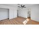 Open bedroom showing closet, hardwood floors, neutral walls, and a bathroom at 3907 Torsby Pl, Las Vegas, NV 89119