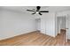 Bedroom with closet, wood-look floors, and modern white trim at 3907 Torsby Pl, Las Vegas, NV 89119