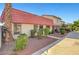 Attractive townhouses with red tile roofs, set amongst neatly manicured landscaping at 3907 Torsby Pl, Las Vegas, NV 89119