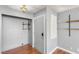 Neutral entryway with wood floors, built-in shelving, and a front door with secure keyless entry at 5043 Spencer St # A, Las Vegas, NV 89119