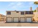 Townhome garages with upstairs living space and stucco exterior offer functionality and classic style at 5043 Spencer St # A, Las Vegas, NV 89119