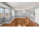 Spacious living room with hardwood floors, ample natural light and neutral paint, ready for personal touches at 5043 Spencer St # A, Las Vegas, NV 89119