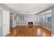 Bright living room with fireplace, hardwood floors, multiple windows, and neutral paint, perfect for relaxation at 5043 Spencer St # A, Las Vegas, NV 89119