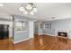 Open living space with fireplace, breakfast bar, and a kitchen view, ideal for entertaining at 5043 Spencer St # A, Las Vegas, NV 89119