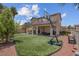Spacious backyard featuring well-maintained turf, a patio, and a basketball hoop at 5228 Giallo Vista Ct, North Las Vegas, NV 89031