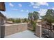 Covered balcony area with views of surrounding trees and homes at 5228 Giallo Vista Ct, North Las Vegas, NV 89031