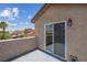 Balcony with stucco wall and views of the neighboring houses at 5228 Giallo Vista Ct, North Las Vegas, NV 89031