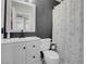 Bathroom vanity with a modern black faucet and butterfly themed shower curtain at 5228 Giallo Vista Ct, North Las Vegas, NV 89031