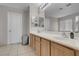 Bathroom with double sinks and under sink cabinet storage offers elegance and functionality at 5228 Giallo Vista Ct, North Las Vegas, NV 89031