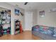 Bedroom with ceiling fan and grey walls with fun decorations throughout at 5228 Giallo Vista Ct, North Las Vegas, NV 89031