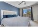 Bedroom boasting large windows and accent wall, creating a comfortable atmosphere at 5228 Giallo Vista Ct, North Las Vegas, NV 89031