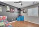 room with dark grey accent wall, Spiderman decor, and ceiling fan at 5228 Giallo Vista Ct, North Las Vegas, NV 89031