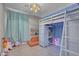 Bedroom with a lofted bed, ladder, play area, and colorful decor at 5228 Giallo Vista Ct, North Las Vegas, NV 89031