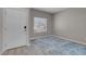Clean entryway featuring light gray walls, wood flooring, and a decorative blue area rug at 5228 Giallo Vista Ct, North Las Vegas, NV 89031