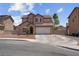 Charming two-story home features a desert landscape, attached garage, and neutral color palette at 5228 Giallo Vista Ct, North Las Vegas, NV 89031