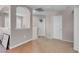 Hallway featuring neutral paint and wood floors leads into the other bedrooms at 5228 Giallo Vista Ct, North Las Vegas, NV 89031