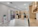 Well-lit kitchen with stainless appliances, oak cabinets, and a view of the outdoor patio at 5228 Giallo Vista Ct, North Las Vegas, NV 89031