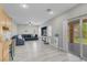 Spacious and airy living room flows to an outdoor area, and modern furnishings at 5228 Giallo Vista Ct, North Las Vegas, NV 89031